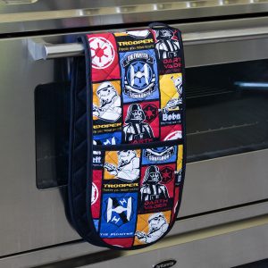 blue, red, yellow, Star Wars fabric made into a double oven mitt, hanging on a silver oven